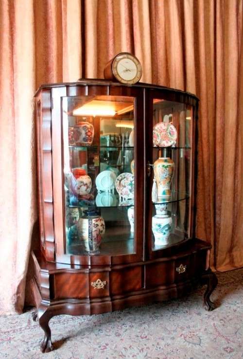An exquisite ball & claw 2 glass door show cabinet w/ 2 bottom drawers, light and brass handles!!