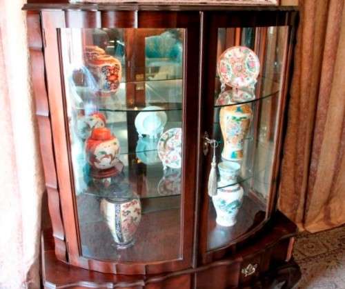 An exquisite ball & claw 2 glass door show cabinet w/ 2 bottom drawers, light and brass handles!!