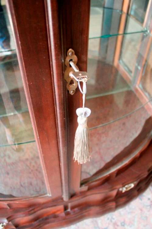 An exquisite ball & claw 2 glass door show cabinet w/ 2 bottom drawers, light and brass handles!!