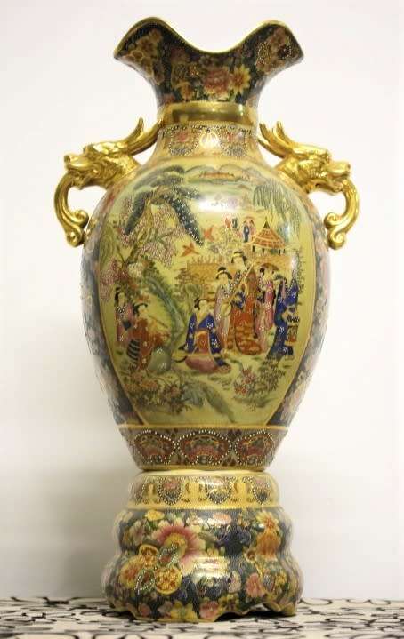 A spectacular and beautifully decorated Japanese Satsuma vase with gold gilt dragon-head handles