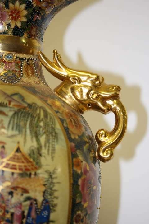 A spectacular and beautifully decorated Japanese Satsuma vase with gold gilt dragon-head handles