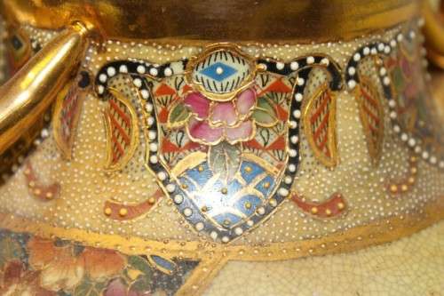 A spectacular and beautifully decorated Japanese Satsuma vase with gold gilt dragon-head handles