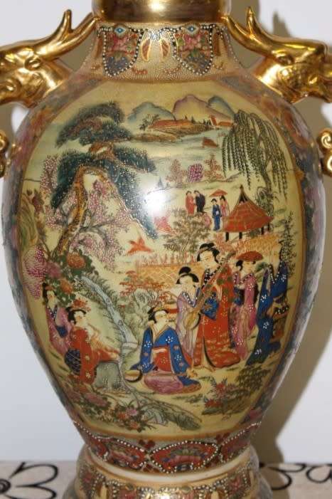 A spectacular and beautifully decorated Japanese Satsuma vase with gold gilt dragon-head handles