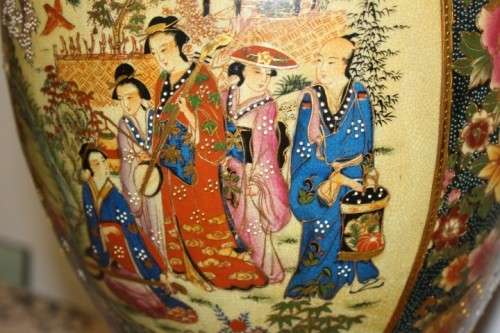 A spectacular and beautifully decorated Japanese Satsuma vase with gold gilt dragon-head handles