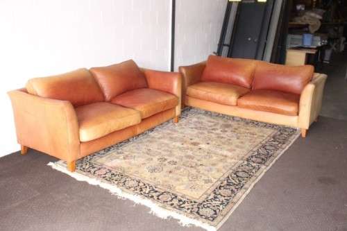 Two stunning and very comfortable large genuine full-grain tan leather couches w/ removable cushions