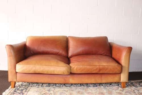 Two stunning and very comfortable large genuine full-grain tan leather couches w/ removable cushions