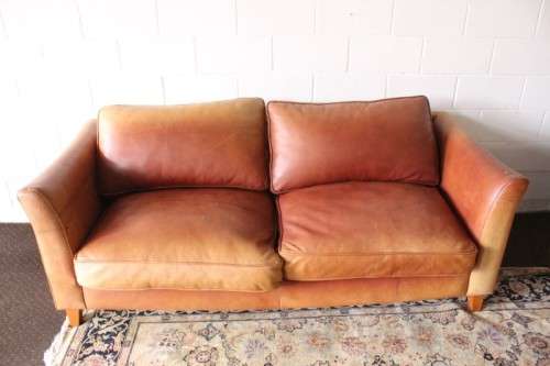Two stunning and very comfortable large genuine full-grain tan leather couches w/ removable cushions