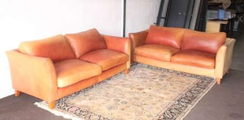 Two stunning and very comfortable large genuine full-grain tan leather couches w/ removable cushions