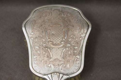 A beautiful antique vanity brush & mirror set w gorgeous pressed detailing.