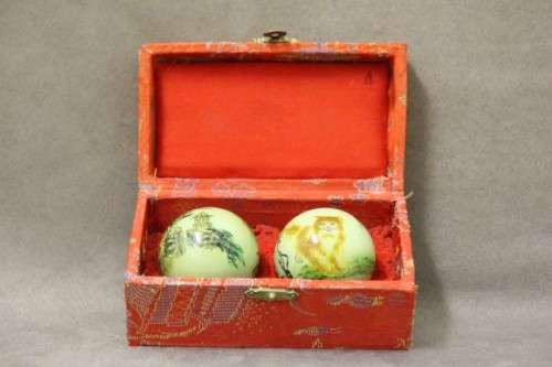 A stunning boxed set of hand painted, scenery themed Chinese cloisonne enamelled Ben-wa balls