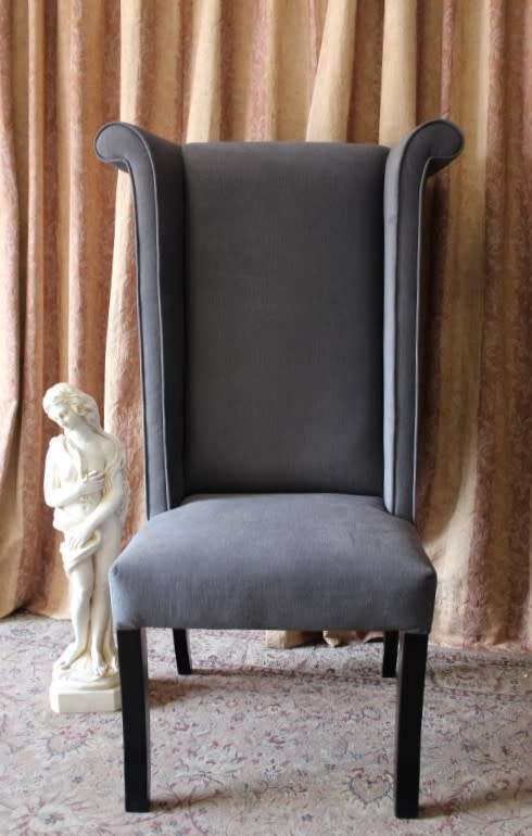 An exceptional brand new oversized wing back chair in a durable grey fabric. Great "Feature" chair.