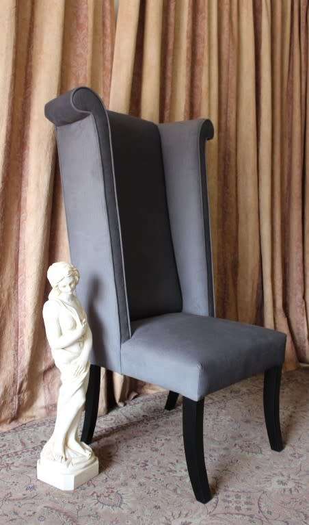 An exceptional brand new oversized wing back chair in a durable grey fabric. Great "Feature" chair.