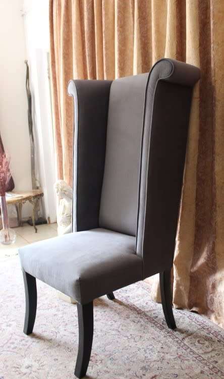 An exceptional brand new oversized wing back chair in a durable grey fabric. Great "Feature" chair.