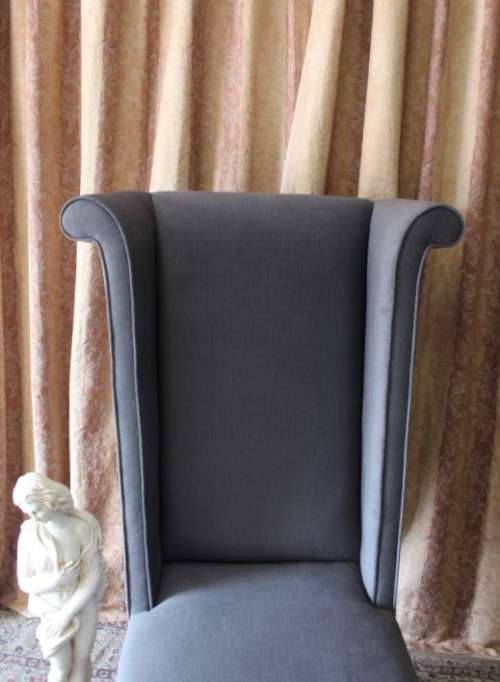 An exceptional brand new oversized wing back chair in a durable grey fabric. Great "Feature" chair.