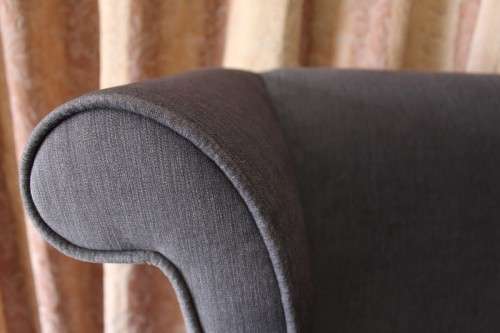 An exceptional brand new oversized wing back chair in a durable grey fabric. Great "Feature" chair.