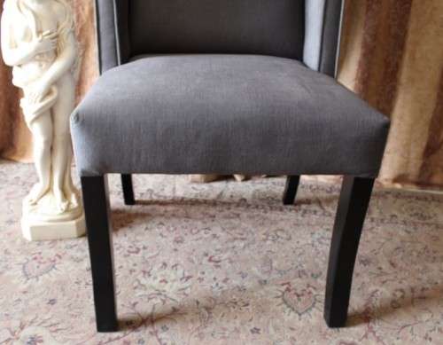 An exceptional brand new oversized wing back chair in a durable grey fabric. Great "Feature" chair.