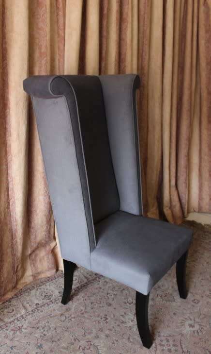 An exceptional brand new oversized wing back chair in a durable grey fabric. Great "Feature" chair.