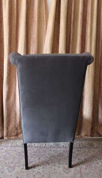 An exceptional brand new oversized wing back chair in a durable grey fabric. Great "Feature" chair.