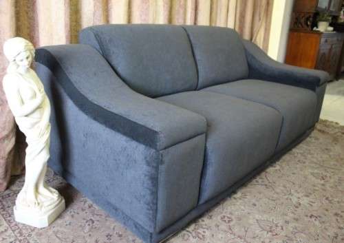 A fantastic ultra modern, "new" extremely well made (195cm long) 2 seater grey upholstered couch.