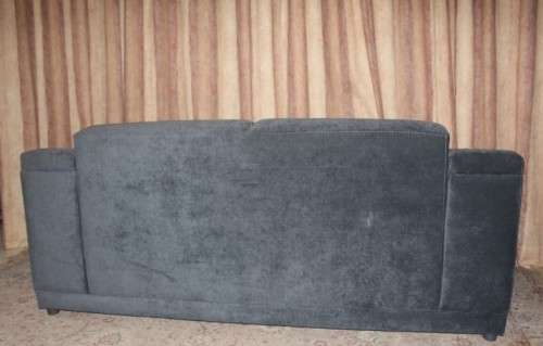 A fantastic ultra modern, "new" extremely well made (195cm long) 2 seater grey upholstered couch.