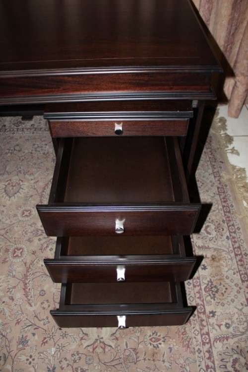 An amazing 'new" well made large darkened Oak executives desk with a 4 drawer removable pedestal