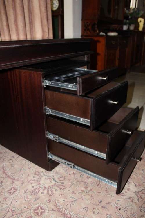 An amazing 'new" well made large darkened Oak executives desk with a 4 drawer removable pedestal