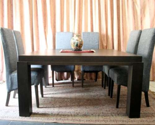 A stunning, new ultra modern 8 seater square dining room table w/ 8 high back upholstered chairs!