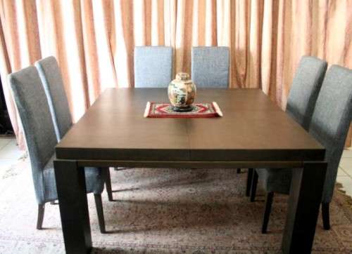 A stunning, new ultra modern 8 seater square dining room table w/ 8 high back upholstered chairs!