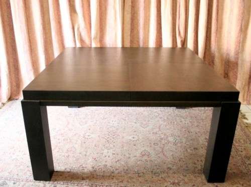 A stunning, new ultra modern 8 seater square dining room table w/ 8 high back upholstered chairs!