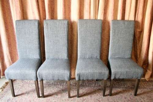 A stunning, new ultra modern 8 seater square dining room table w/ 8 high back upholstered chairs!