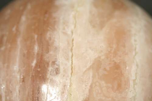 An amazing Himalayan Crystal Salt lamp on a wooden base in complete working condition