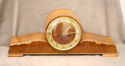 A gorgeous German made Art deco style "EMES" wind up gong chiming mantle clock in working condition.
