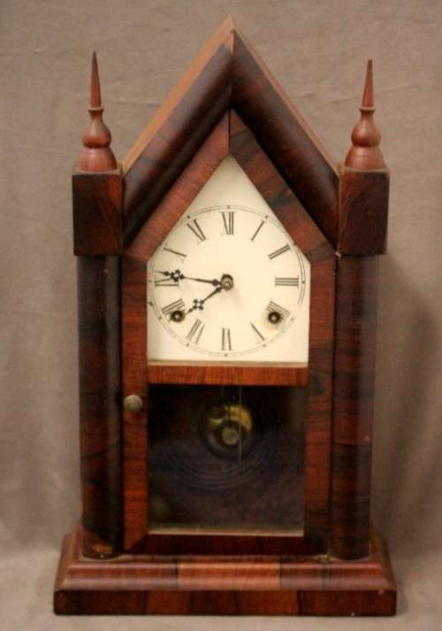 A fabulous antique American Waterbury Steeple pendulum clock in a Mahogany case