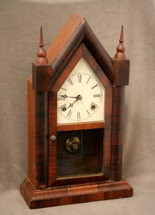 A fabulous antique American Waterbury Steeple pendulum clock in a Mahogany case