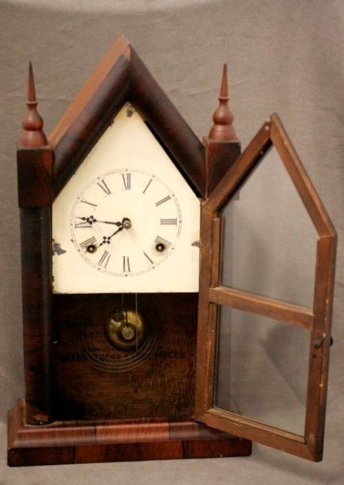 A fabulous antique American Waterbury Steeple pendulum clock in a Mahogany case