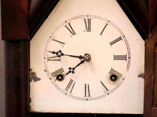 A fabulous antique American Waterbury Steeple pendulum clock in a Mahogany case