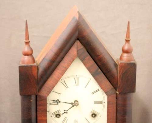 A fabulous antique American Waterbury Steeple pendulum clock in a Mahogany case