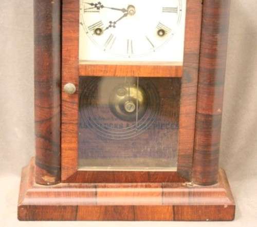 A fabulous antique American Waterbury Steeple pendulum clock in a Mahogany case