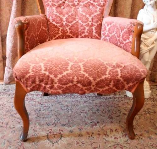 An elegant pair of vintage Queen Anne styled arm chairs w/ button detailing & gorgeous pink fabric.