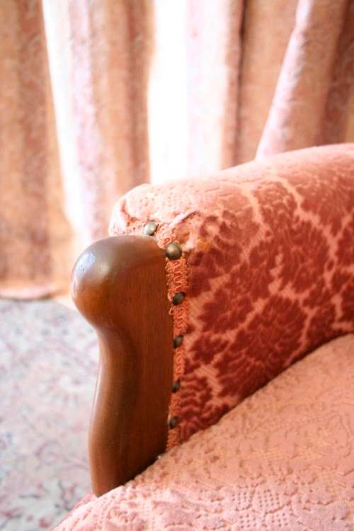 An elegant pair of vintage Queen Anne styled arm chairs w/ button detailing & gorgeous pink fabric.