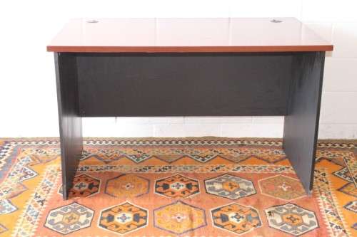 A lovely cherry-wood colour and black framed 120cm office/ study desk - perfect for a smaller space