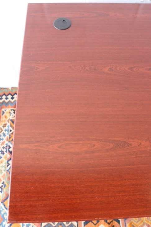 A lovely cherry-wood colour and black framed 120cm office/ study desk - perfect for a smaller space