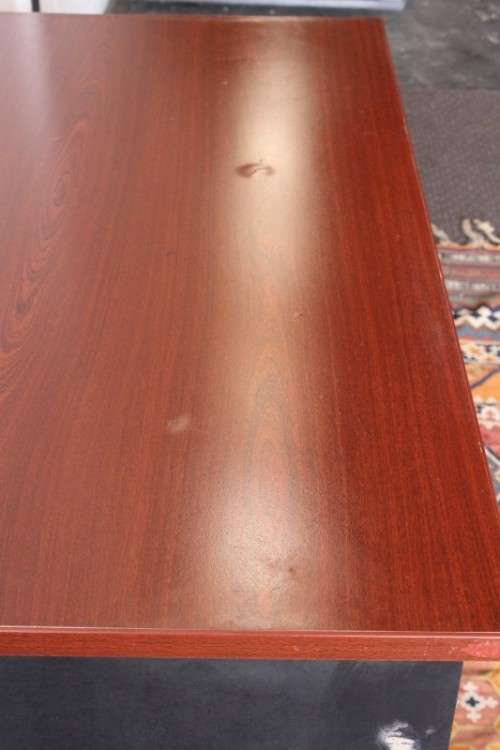 A lovely cherry-wood colour and black framed 120cm office/ study desk - perfect for a smaller space