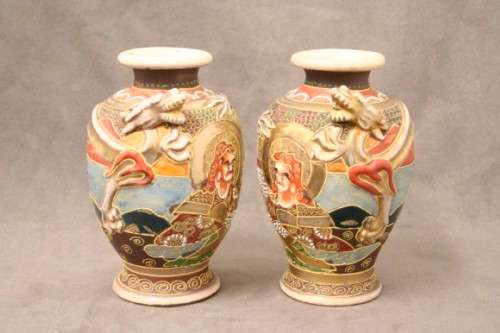 An incredible pair of Japanese Satsuma "Moriage Dragonware" porcelain vases with raised dragons