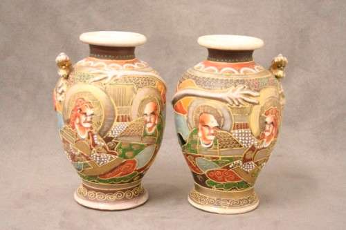 An incredible pair of Japanese Satsuma "Moriage Dragonware" porcelain vases with raised dragons