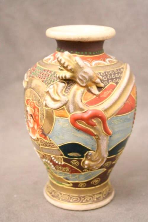 An incredible pair of Japanese Satsuma "Moriage Dragonware" porcelain vases with raised dragons