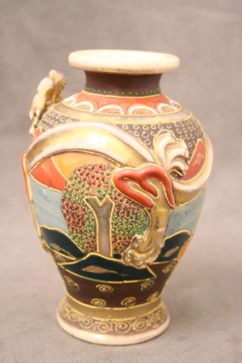 An incredible pair of Japanese Satsuma "Moriage Dragonware" porcelain vases with raised dragons