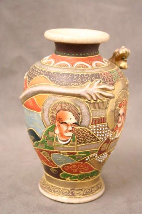 An incredible pair of Japanese Satsuma "Moriage Dragonware" porcelain vases with raised dragons