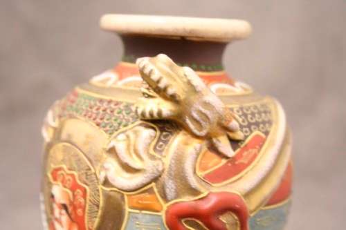 An incredible pair of Japanese Satsuma "Moriage Dragonware" porcelain vases with raised dragons