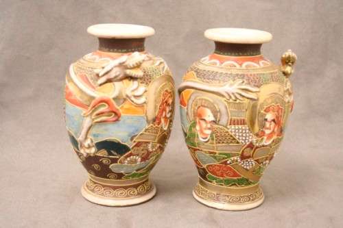 An incredible pair of Japanese Satsuma "Moriage Dragonware" porcelain vases with raised dragons